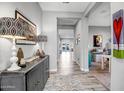 Spacious entryway with gray walls, tile floor, and a console table at 210 E Balao Dr, Phoenix, AZ 85085