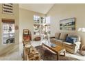Inviting living room showcases vaulted ceiling, lots of natural light and neutral decor at 5951 E Trailridge St, Mesa, AZ 85215