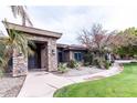 Front entrance of a house with stone accents and walkway at 100 W Sparrow Dr, Chandler, AZ 85286