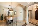 Elegant dining room featuring a large wooden table and high ceilings at 11714 N 134Th St, Scottsdale, AZ 85259