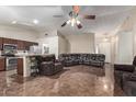 Kitchen with granite countertops, stainless steel appliances, and dark wood cabinets at 2535 N 87Th Ave, Phoenix, AZ 85037