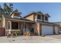 Two-story house with a brick facade, three-car garage, and landscaped front yard at 8934 W Ocotillo Rd, Glendale, AZ 85305