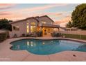 Inviting kidney shaped pool and patio area at 1763 S Red Rock St, Gilbert, AZ 85295