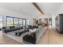 Spacious living room with modern decor, plush sofas, and hardwood floors, creating a comfortable and stylish atmosphere at 6040 E Lafayette Blvd, Scottsdale, AZ 85251