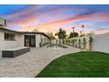 Backyard features a pool, patio, and grassy lawn at 1302 W Golden Ln, Phoenix, AZ 85021