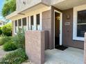 Welcoming entrance with well maintained landscaping and a clearly visible address at 15221 N Clubgate Dr # 1110, Scottsdale, AZ 85254
