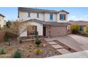 Two-story home with stone accents and landscaped front yard at 18407 W Fulton St, Goodyear, AZ 85338