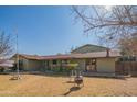 House with a fire pit and spacious yard at 10407 W Catalina Dr, Avondale, AZ 85392