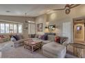 Relaxing living room with sectional sofa and plenty of seating at 3212 E Desert Cove Ave, Phoenix, AZ 85028