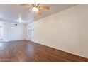 Bright living room with hardwood floors and ceiling fan at 3555 S Payton St, Mesa, AZ 85212