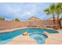Inviting backyard oasis featuring a sparkling pool and spa at 3555 S Payton St, Mesa, AZ 85212