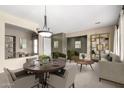 Bright dining room with a table, chairs, and access to living area at 8141 E Apache Plumb Dr, Gold Canyon, AZ 85118
