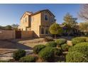 Tan two-story house with a landscaped yard and walkway at 1850 S Martingale Rd, Gilbert, AZ 85295