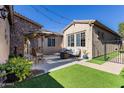 Private backyard with artificial turf and a sitting area at 2554 E Honeysuckle Pl, Chandler, AZ 85286