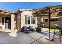Outdoor patio with seating area, fire pit, and umbrella at 2554 E Honeysuckle Pl, Chandler, AZ 85286