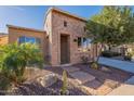 Brick home exterior with a landscaped front yard at 1351 E Artemis Trl, Queen Creek, AZ 85140