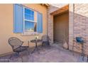 Cozy patio with wrought iron chairs and a small table at 1351 E Artemis Trl, Queen Creek, AZ 85140