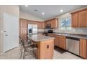 Spacious kitchen with stainless steel appliances and an island at 1435 E Debbie Dr, San Tan Valley, AZ 85140