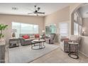Cozy living room featuring a comfortable sofa and two armchairs at 1435 E Debbie Dr, San Tan Valley, AZ 85140
