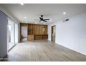 Spacious living area with wood built-ins and hardwood-style floors at 1905 W Cambridge Ave, Phoenix, AZ 85009