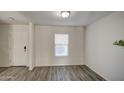 Bright entryway with wood-look floors and neutral walls at 227 W Bobcat Ct, Casa Grande, AZ 85122