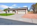 Charming brick home with a 2-car garage and desert landscaping at 2720 W Libby St, Phoenix, AZ 85053