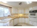 Efficient kitchen with white appliances and wood countertops at 8103 E Southern Ave # 287, Mesa, AZ 85208