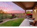 Covered patio with built-in grill and seating area at 11157 E Greenway Rd, Scottsdale, AZ 85255