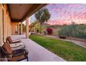 Spacious covered patio with seating area and mountain views at 11157 E Greenway Rd, Scottsdale, AZ 85255