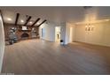 Open concept living and dining area with hardwood floors at 1745 E Glade Ave, Mesa, AZ 85204