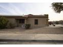 Front view of the house with a walkway and drought-tolerant landscaping at 44920 W Miraflores St, Maricopa, AZ 85139