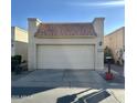 Attached garage with off-white door and terracotta tile roof at 771 E Pepper Dr, Casa Grande, AZ 85122