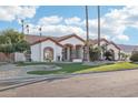 Inviting home with a large front yard, mature trees, and a two-car garage at 9623 W Tierra Grande --, Peoria, AZ 85383