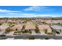 Aerial view of a quiet residential neighborhood with a community park at 21576 E Pecan Ct, Queen Creek, AZ 85142