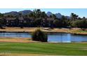 Golf course community with lake, mature trees, and mountain views at 5122 E Shea Blvd # 1117, Scottsdale, AZ 85254