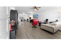 Open concept living area with hardwood floors and a view into the dining area at 5835 E Dodge St, Mesa, AZ 85205