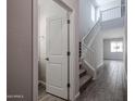 Bright entryway with tile flooring leads to stairs and a powder room, offering modern convenience at 2610 E Bluff Spring Ave, Apache Junction, AZ 85119