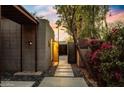 Inviting side entrance with stone pathway and lush landscaping at 3320 N 44Th St, Phoenix, AZ 85018