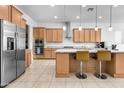 Modern kitchen with stainless steel appliances and an island at 4219 N 161St Ave, Goodyear, AZ 85395