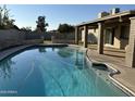 Inviting backyard pool and covered patio, perfect for outdoor relaxation and entertaining at 4643 W Laurel Ln, Glendale, AZ 85304