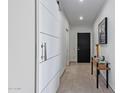Bright entryway with modern barn door and console table at 7120 E Kierland Blvd # 307, Scottsdale, AZ 85254