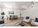 Open floor plan with ample natural light, modern decor, and a dining area perfect for entertaining at 135 E Julian Dr, Gilbert, AZ 85295