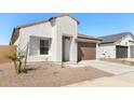 Attractive one-story home boasting a 2-car garage, simple landscaping and a private entrance at 16580 N Dante Way, Maricopa, AZ 85138