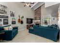 Spacious living room with stone fireplace and large sectional sofa at 4238 N 44Th St, Phoenix, AZ 85018