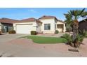 One-story house with a landscaped front yard and attached garage at 2042 E Aire Libre Ave, Phoenix, AZ 85022
