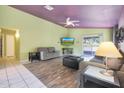 Bright living room with hardwood floors and a view of the backyard at 2042 E Aire Libre Ave, Phoenix, AZ 85022