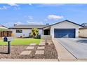 Inviting home exterior showcasing meticulous landscaping, desert accents and a convenient attached garage at 3807 N 87Th St, Scottsdale, AZ 85251