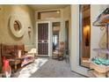 Inviting courtyard entry with a seating area and tile flooring at 18626 E Amarado Cir, Rio Verde, AZ 85263