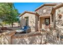 Cozy front patio with wicker furniture and a wrought-iron gate at 4118 E Narrowleaf Dr, Gilbert, AZ 85298