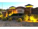Stone community entrance sign for Cooper Corners with decorative lighting and landscaping at 1923 E Zion Way, Chandler, AZ 85249